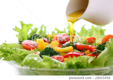Apply olive oil to vegetable salad 28015456