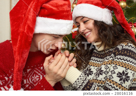 Happy couple in christmas decoration, new year Happy couple in christmas decoration, new year 28016116