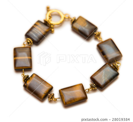 Elegant jewellery isolated on the white background Elegant jewellery isolated on the white background 28019384