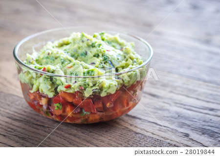 Bowl of guacamole with salsa 28019844