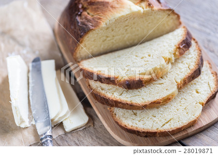 Brioche bread on the wooden board 28019871