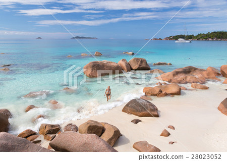 Woman enjoying Anse Lazio picture perfect beach on 28023052