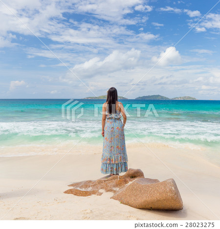 Woman enjoying Anse Patates picture perfect beach 28023275