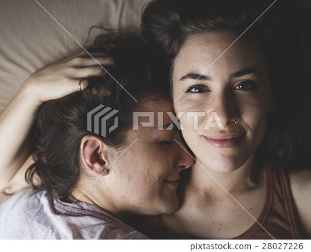 Lesbian Couple Together Indoors Concept Lesbian Couple Together Indoors Concept 28027226
