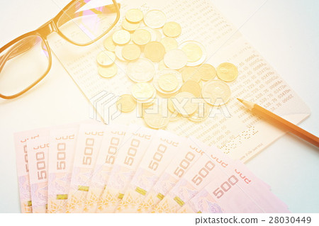 Passbook, money, coins on blue background 28030449