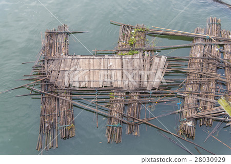 Old bamboo raft is floating on the river Old bamboo raft is floating on the river 28030929