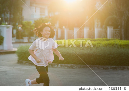 Asian girl  jogging in sunny bright light 28031148