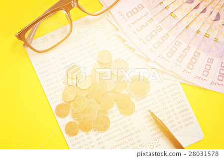 Passbook, money, coins on yellow background Passbook, money, coins on yellow background 28031578