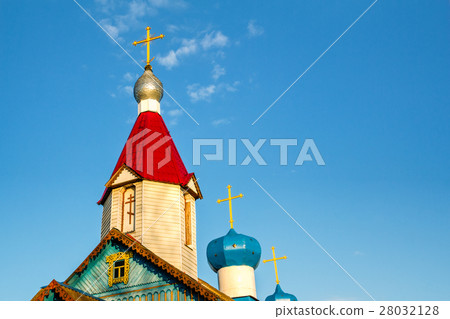 The bell tower of the church with a dome and cross The bell tower of the church with a dome and cross 28032128