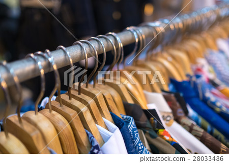 Clothes on clothes rail in clothing store Clothes on clothes rail in clothing store 28033486