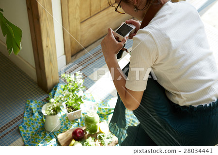 A woman taking home cooking dishes A woman taking home cooking dishes 28034441