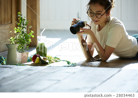 A woman taking home cooking dishes A woman taking home cooking dishes 28034463