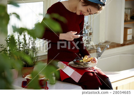 A woman taking home cooking dishes A woman taking home cooking dishes 28034685