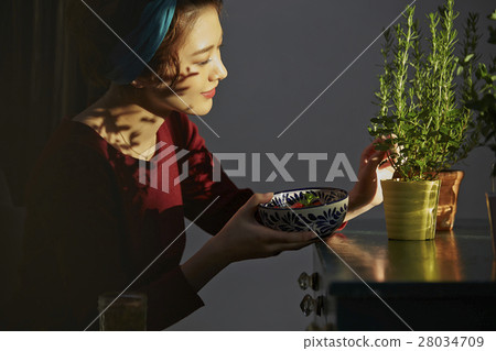 A woman enjoying a family garden A woman enjoying a family garden 28034709