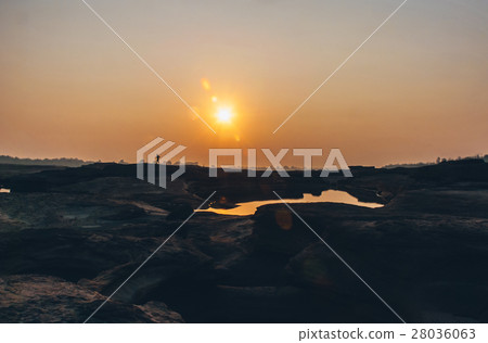 Shadow of runner pass through sun and dry land Shadow of runner pass through sun and dry land 28036063