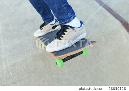 people legs practice skateboarding at skatepark 28039128