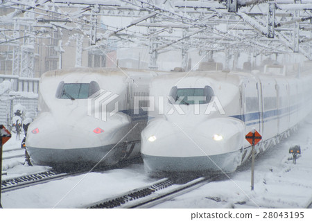 N700 series passing by Yonehara station of heavy snow N700 series passing by Yonehara station of heavy snow 28043195