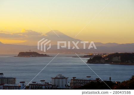 View of Enoshima and Mt. Fuji at dusk from Hiroyama Park in Kamakura City, Kanagawa Prefecture 28043586