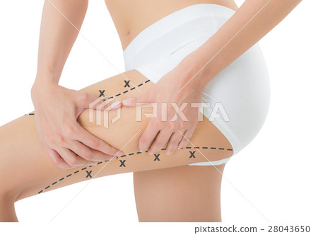 woman grabbing skin on her thigh. 28043650