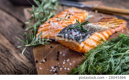 Grilled salmon, sesame seeds and herb decoration. Grilled salmon, sesame seeds and herb decoration. 28045866