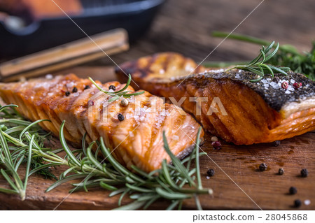 Grilled salmon, sesame seeds and herb decoration. Grilled salmon, sesame seeds and herb decoration. 28045868
