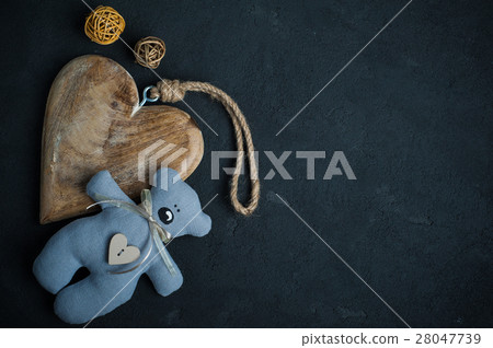 Concrete background with wooden heart 28047739