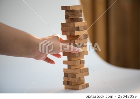 Closeup of asian woman's hand playing wood blocks Closeup of asian woman's hand playing wood blocks 28048059