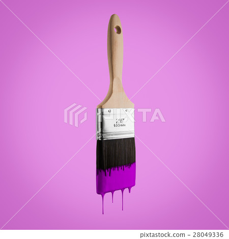 Paintbrush loaded with purple color dripping. 28049336