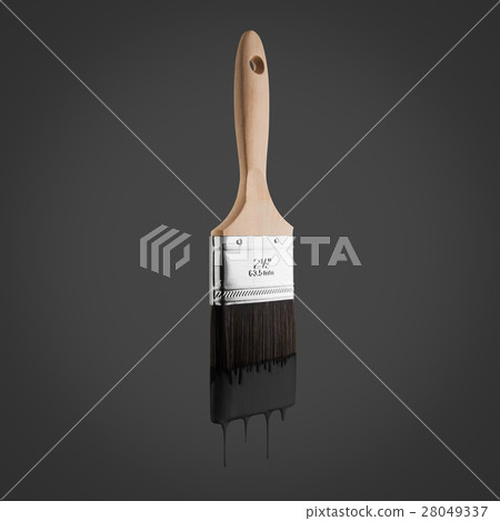 Paintbrush loaded with black color dripping. 28049337