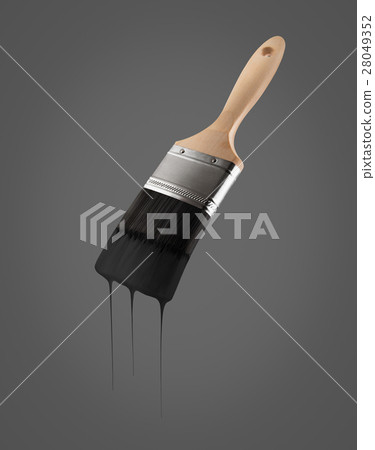 Paintbrush loaded with black color dripping. 28049352