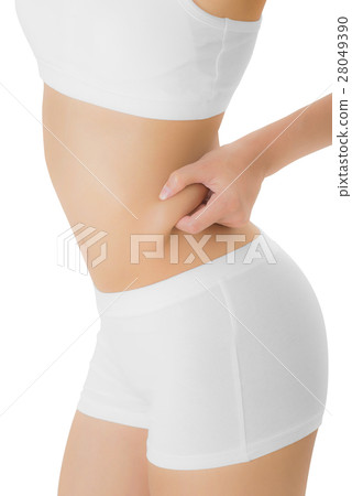 Woman checks and pinching Excess fat on her hip. 28049390