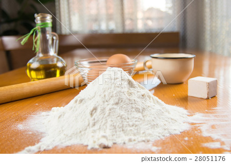 Dough making ingredients on a table Dough making ingredients on a table 28051176