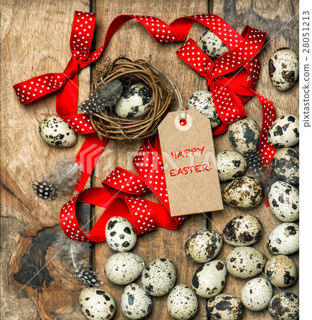 Easter decoration eggs with red ribbon bow and tag 28051213