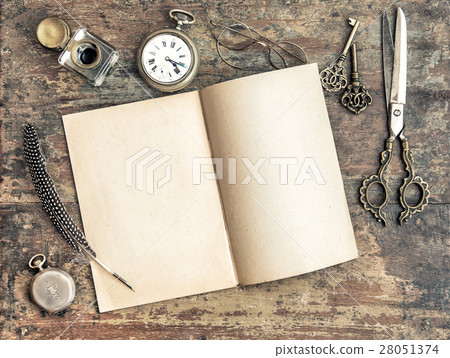 Open book and antique writing tools vintage Open book and antique writing tools vintage 28051374
