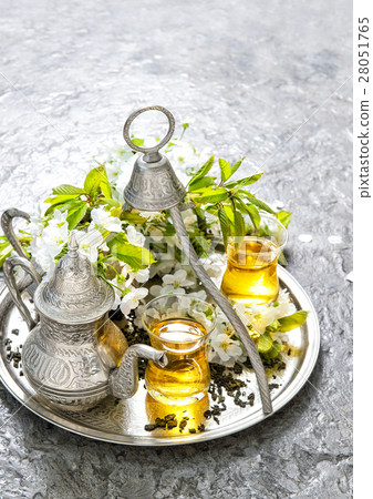 Tea glasses and pot. Oriental holidays decoration 28051765