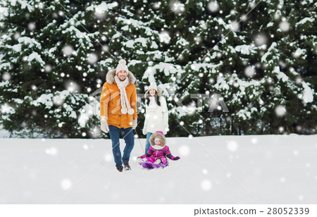 happy family with sled walking in winter forest 28052339