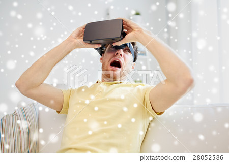 young man in virtual reality headset or 3d glasses 28052586