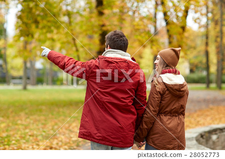 happy young couple walking in autumn park happy young couple walking in autumn park 28052773
