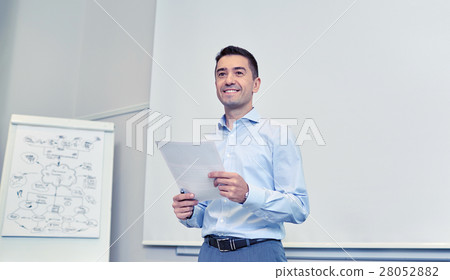 smiling businessman on presentation in office smiling businessman on presentation in office 28052882