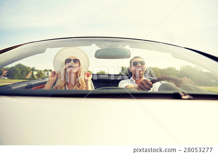 happy man and woman driving in cabriolet car happy man and woman driving in cabriolet car 28053277