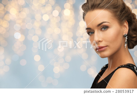 smiling woman in evening dress and earring smiling woman in evening dress and earring 28053917