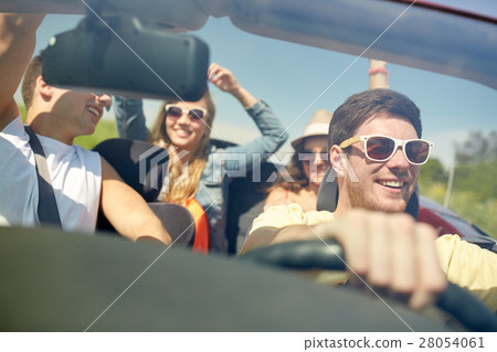 happy friends driving in cabriolet car happy friends driving in cabriolet car 28054061