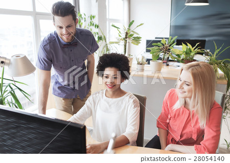 happy creative team with computer in office 28054140