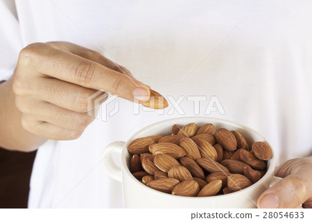 Almonds on a white background. Almonds on a white background. 28054633