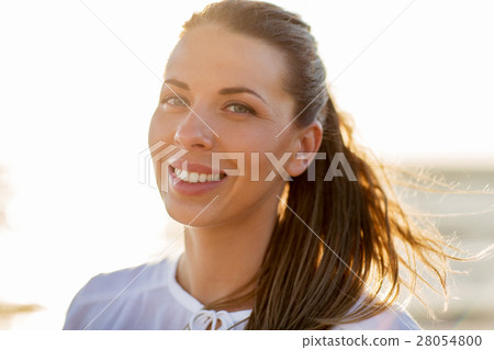 happy smiling young woman face outdoors 28054800