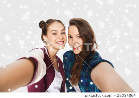 happy smiling pretty teenage girls taking selfie happy smiling pretty teenage girls taking selfie 28054864