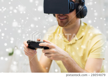 man in virtual reality headset playing man in virtual reality headset playing 28054879