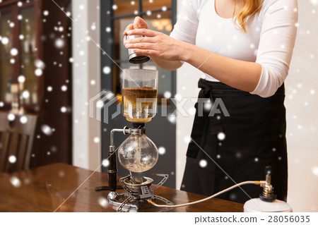 close up of woman with siphon coffee maker and pot 28056035