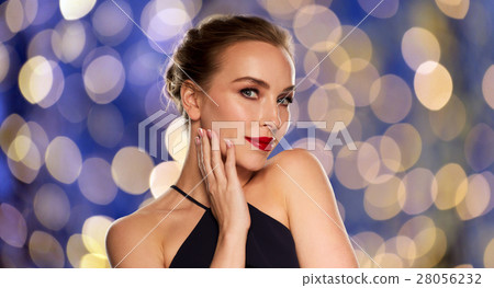 beautiful woman in black over dark background 28056232