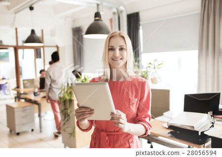 happy creative female office worker with tablet pc 28056594
